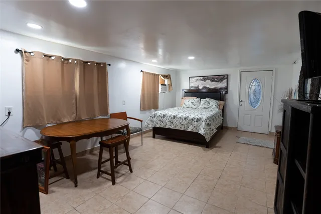 a bedroom with a bed and a table in it