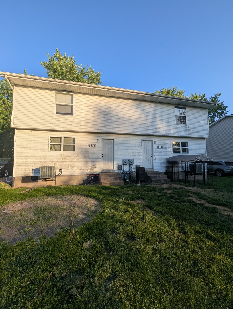 6232-6234 Appomattox Road Davenport, IA 52806 - Photo 2 of 21 a view of a back yard of the house