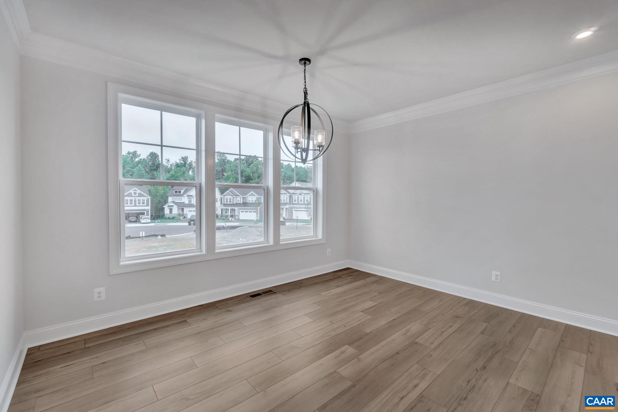 62 B Springdale Road Waynesboro, VA 22980 - Photo 16 of 56 a view of an empty room with wooden floor and a window