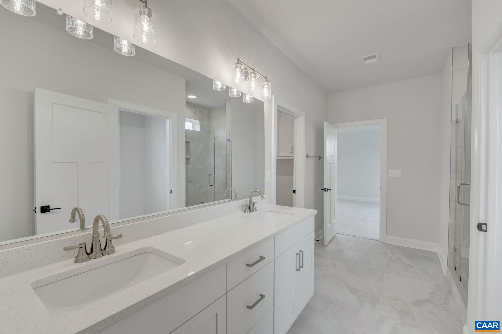 62 B Springdale Road Waynesboro, VA 22980 - Photo 30 of 56 a bathroom with double vanity sinks and a mirror