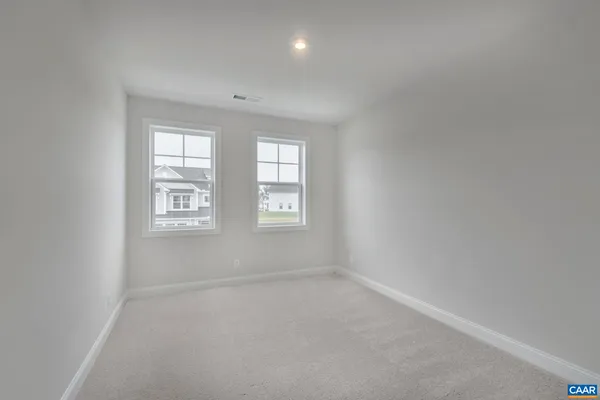 a view of a room with shelf on the wall