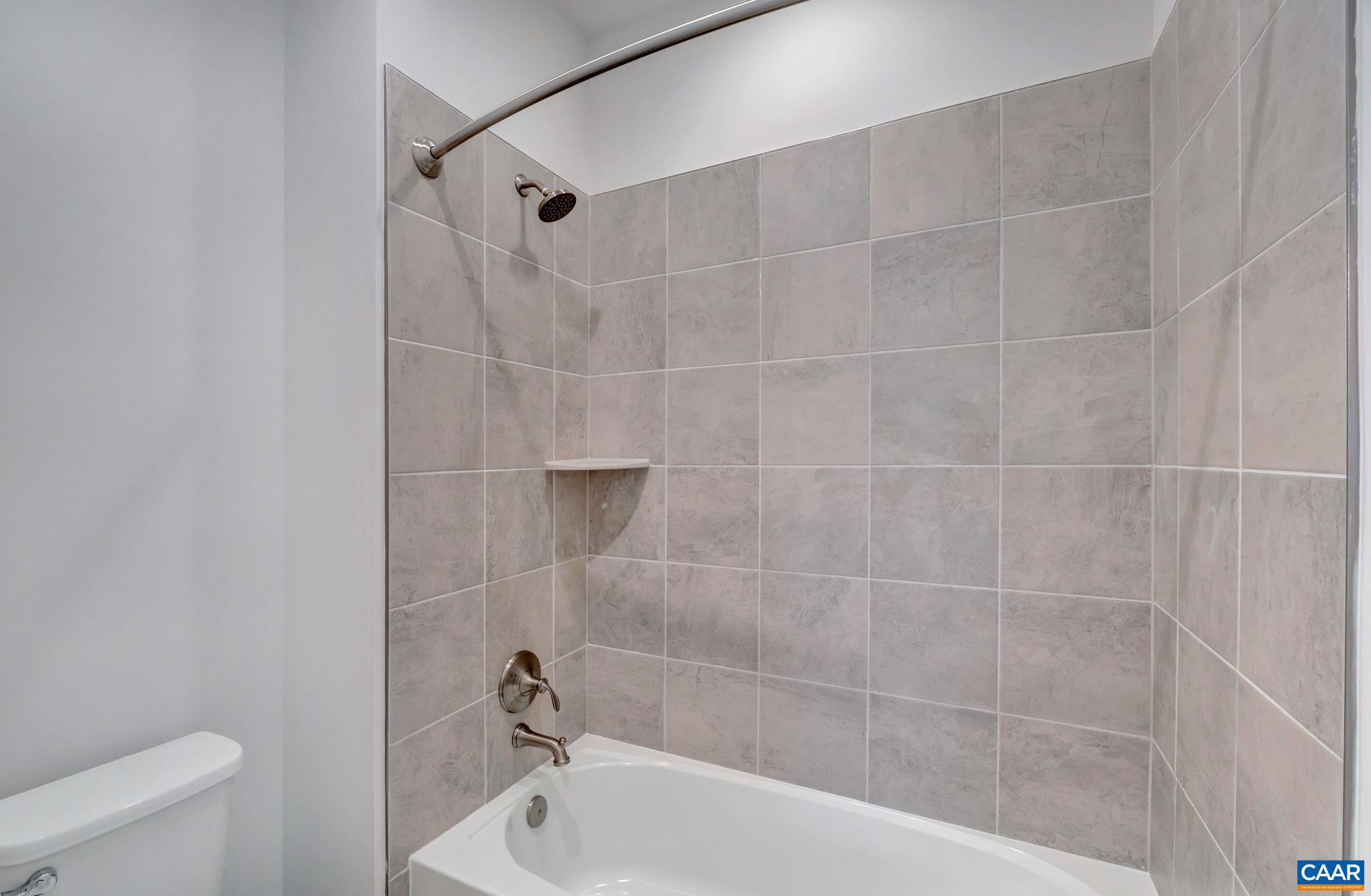 62 B Springdale Road Waynesboro, VA 22980 - Photo 38 of 56 a bathroom with a bathtub and a toilet