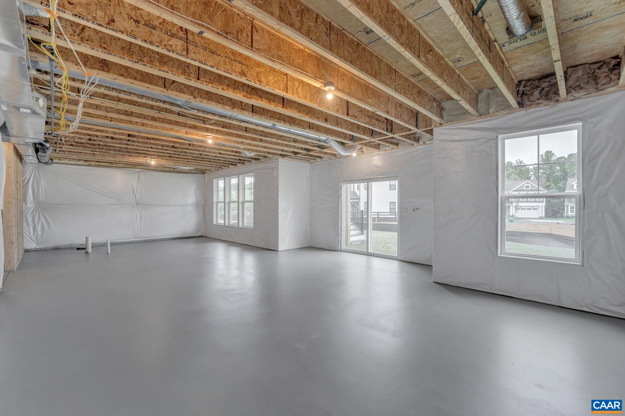 62 B Springdale Road Waynesboro, VA 22980 - Photo 47 of 56 a view of an empty room with wooden floor and a window