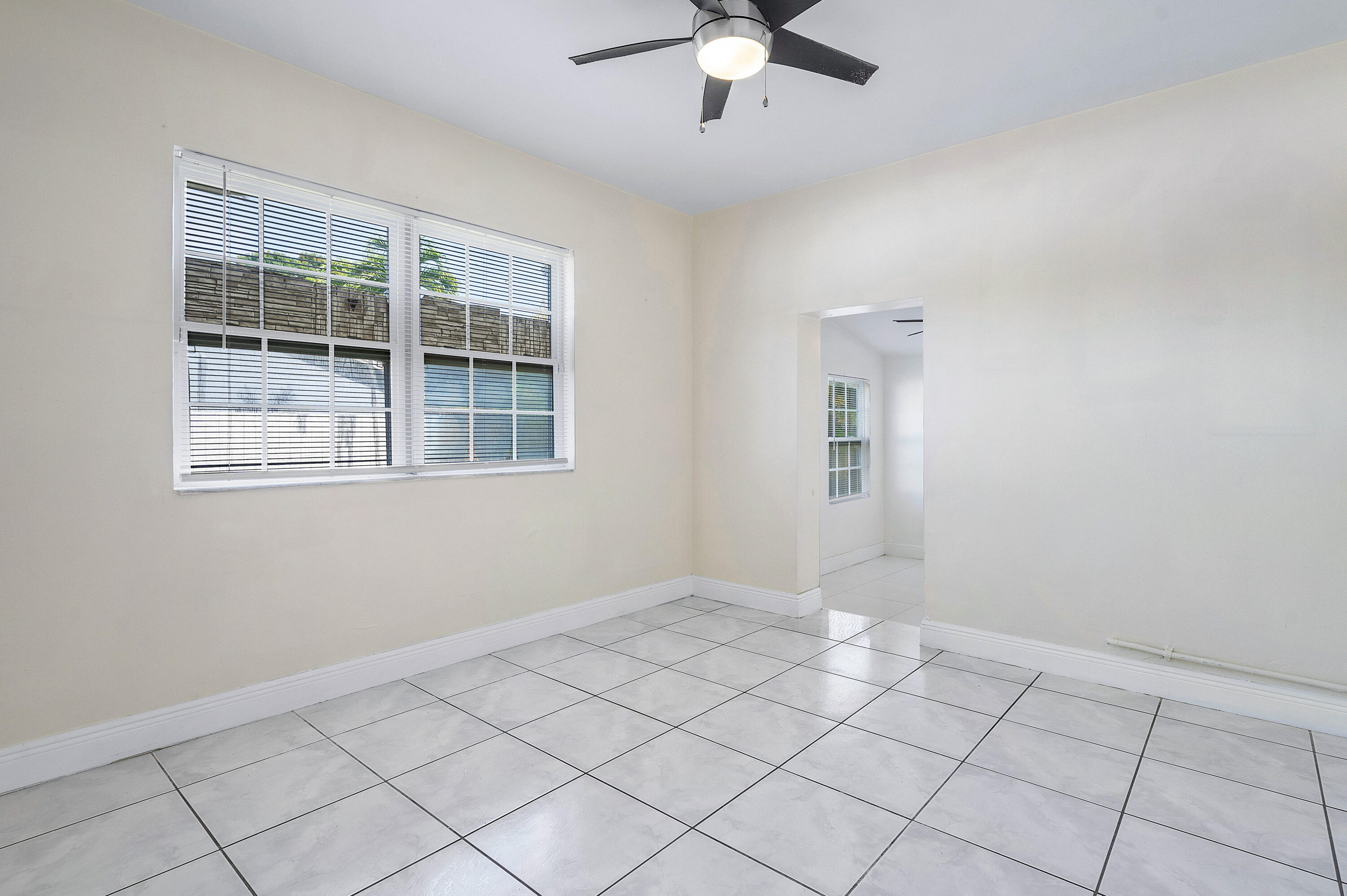 6130 Edwards Road Margate, FL 33063 - Photo 11 of 17 a view of an empty room with a window