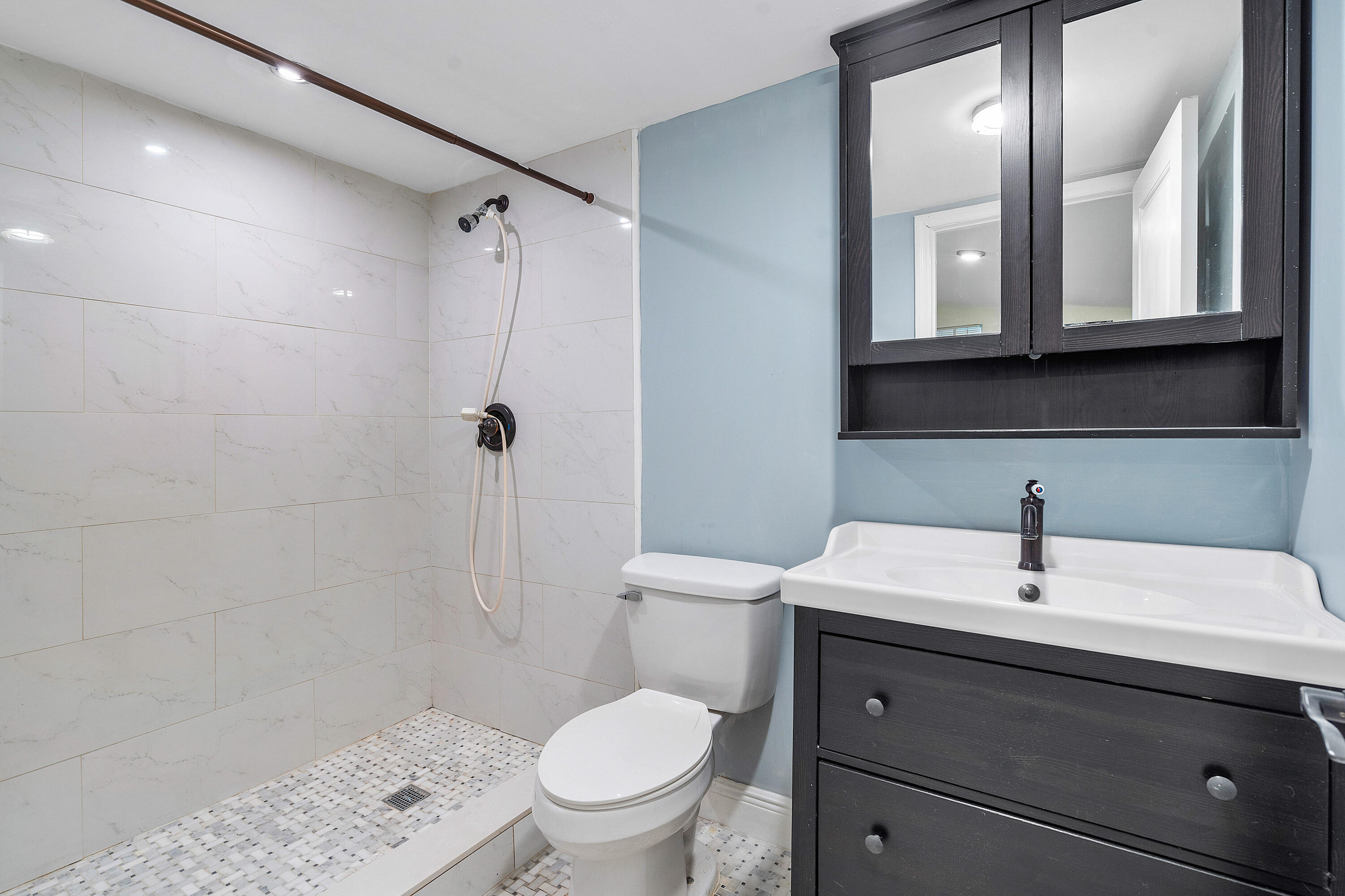 6130 Edwards Road Margate, FL 33063 - Photo 14 of 17 a bathroom with a sink toilet and shower