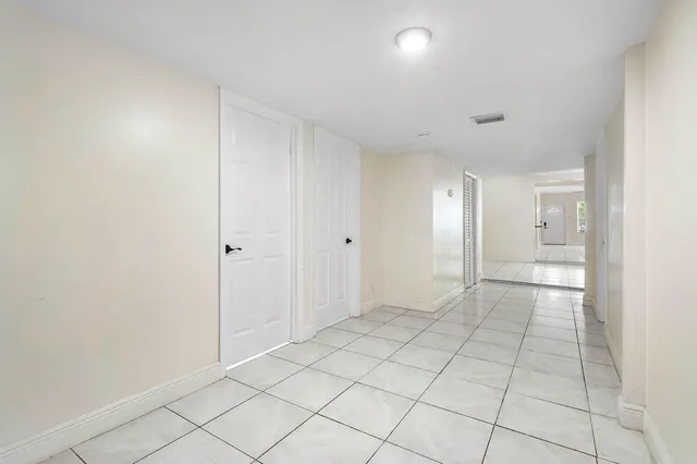 a view of an empty room and window