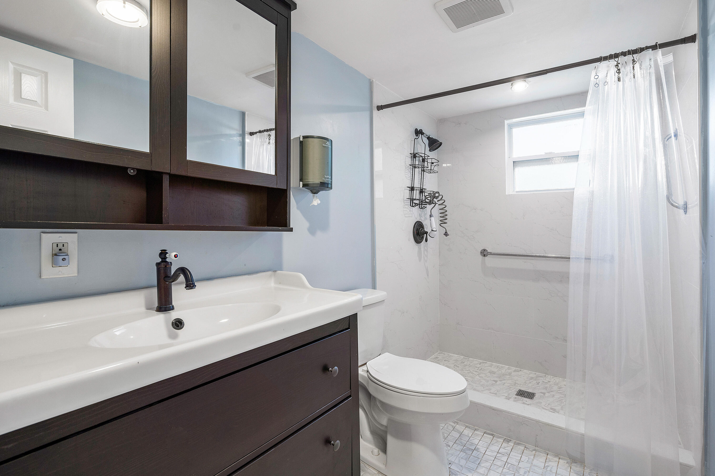 6130 Edwards Road Margate, FL 33063 - Photo 10 of 17 a bathroom with a sink a toilet and shower