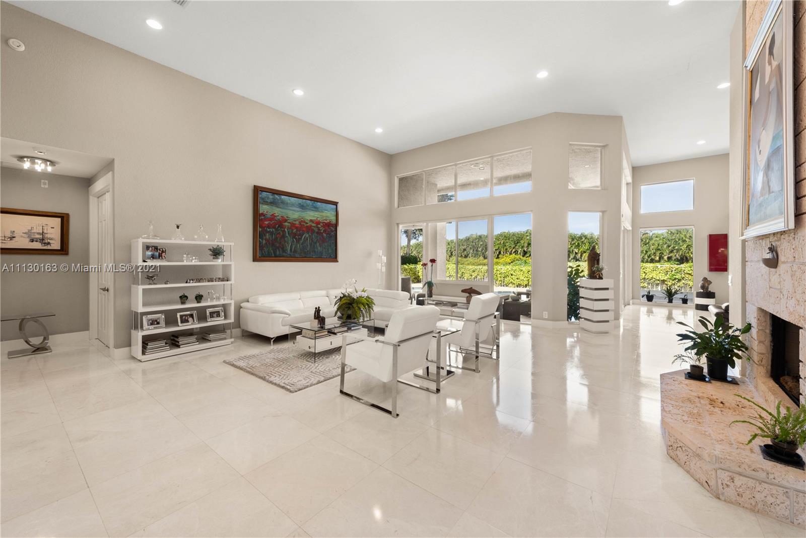 10454 Stonebridge Boulevard Boca Raton, FL 33498 - Photo 4 of 37 a living room with furniture and a large window