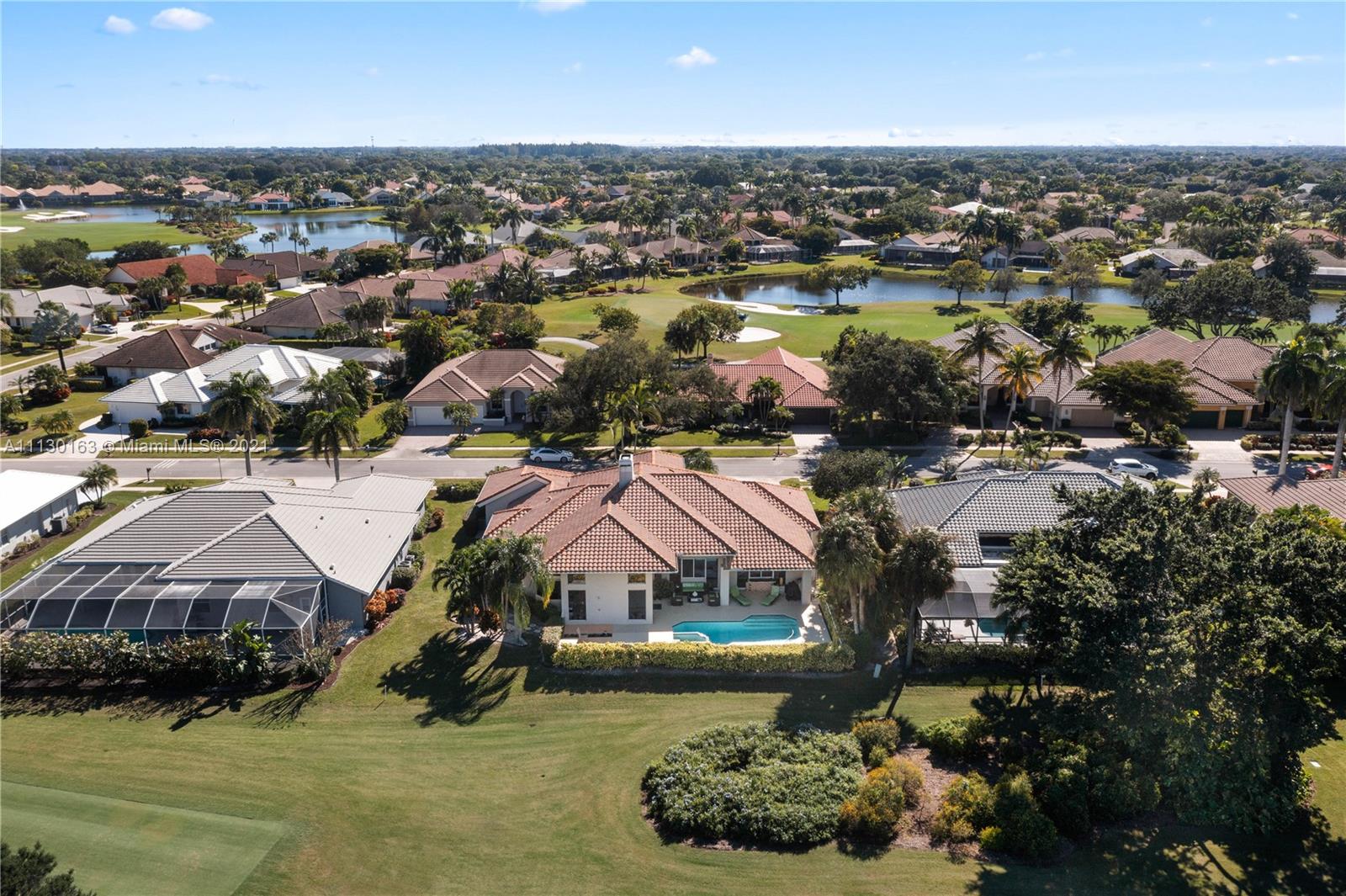 10454 Stonebridge Boulevard Boca Raton, FL 33498 - Photo 9 of 37 an aerial view of a house with a lake view