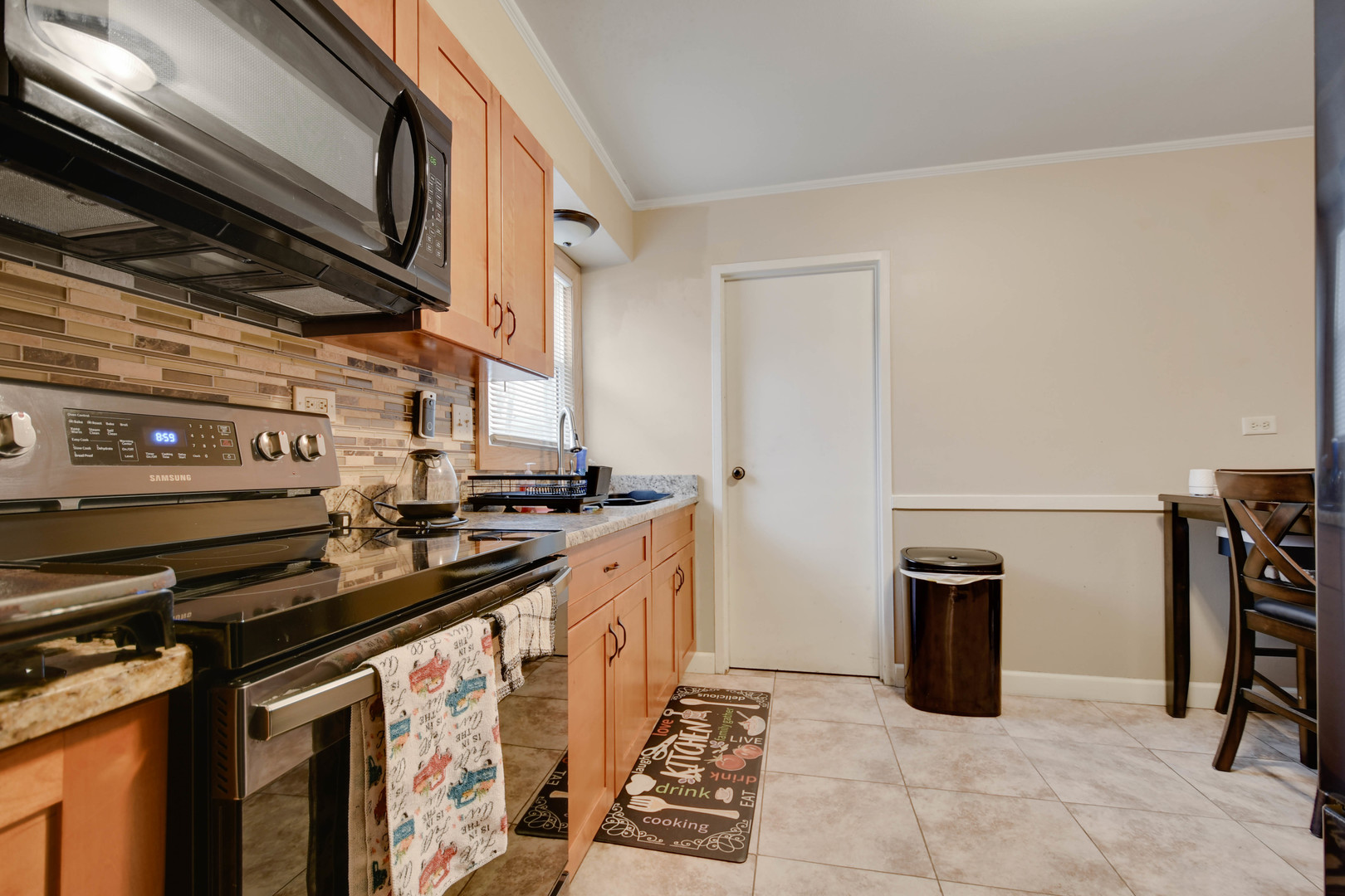 314 Windsor Street Park Forest, IL 60466 - Photo 9 of 20 a kitchen with a stove and a refrigerator