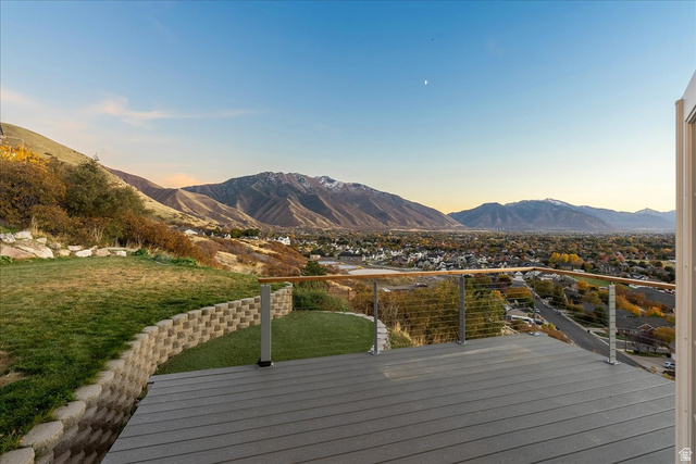 1800 Spring Oaks Drive Springville, UT 84663 - Photo 59 of 68 Deck at dusk with a lawn and a mountain view
