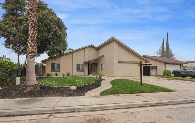 a view of a house and a yard