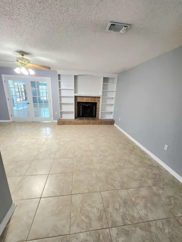 a view of a kitchen with refrigerator and microwave