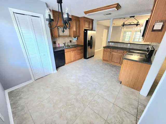 a view of a room with window and cabinet
