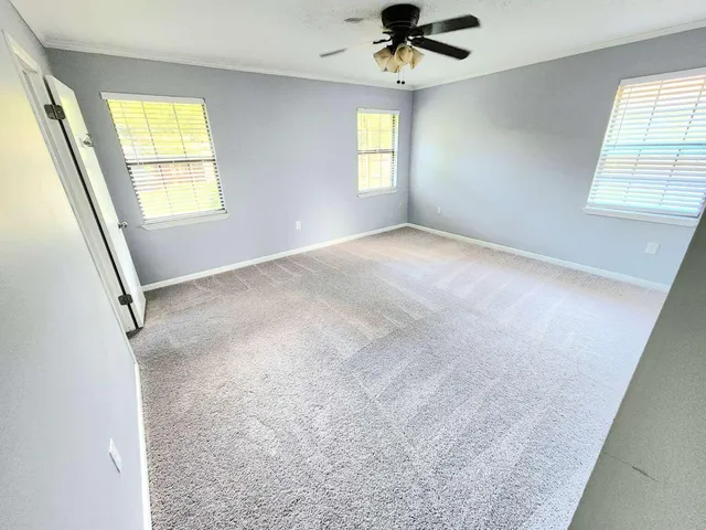 a view of empty room with windows