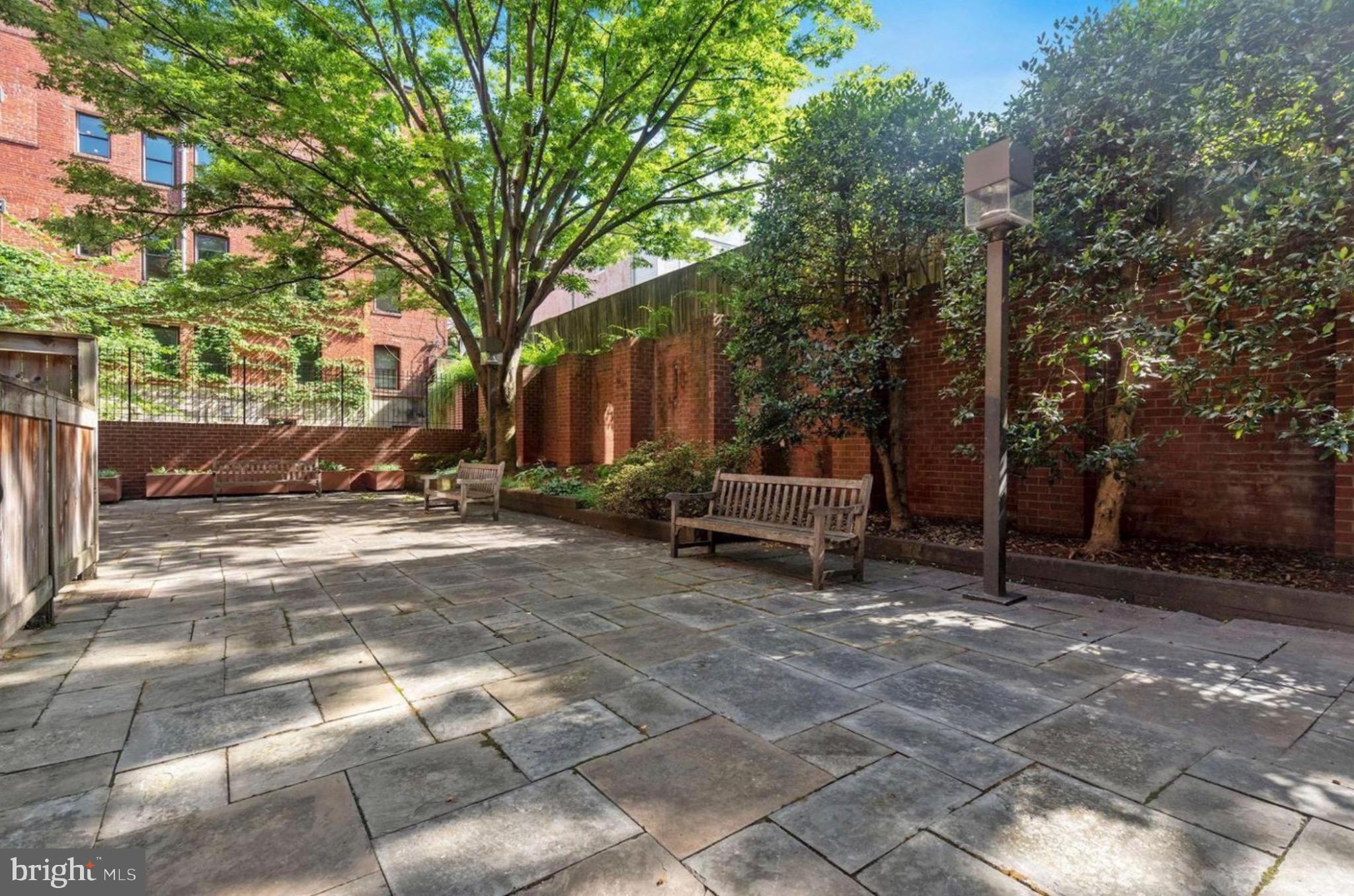 2320 Wisconsin Avenue Northwest, Unit 105 Washington, DC 20007 - Photo 22 of 24 a view of a park with bench and trees