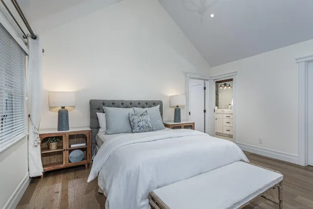 a bed room with a bed and a tv