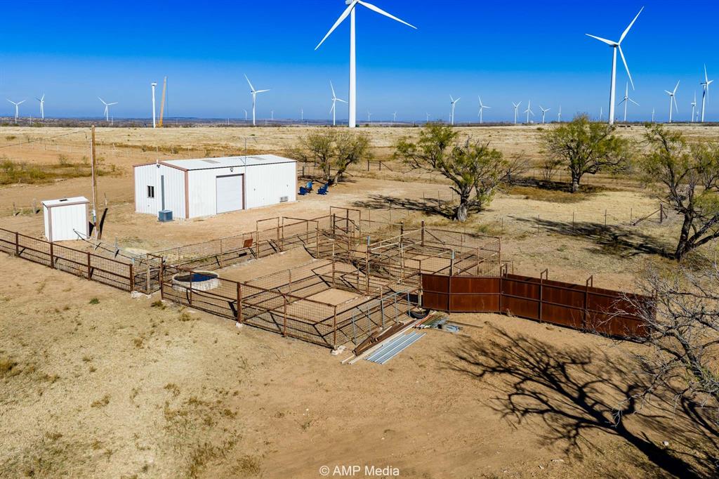 Cr Cr 450th Roscoe, TX 79545 - Photo 13 of 39 a kitchen with a sink and cabinets