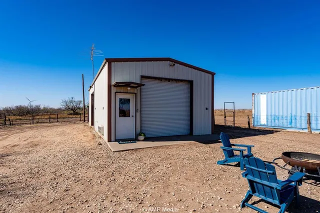 a view of a livingroom with furniture and fire pit