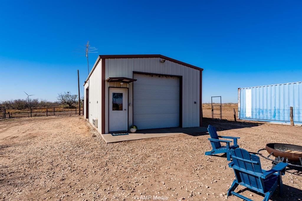 Cr Cr 450th Roscoe, TX 79545 - Photo 15 of 39 a view of a livingroom with furniture and fire pit