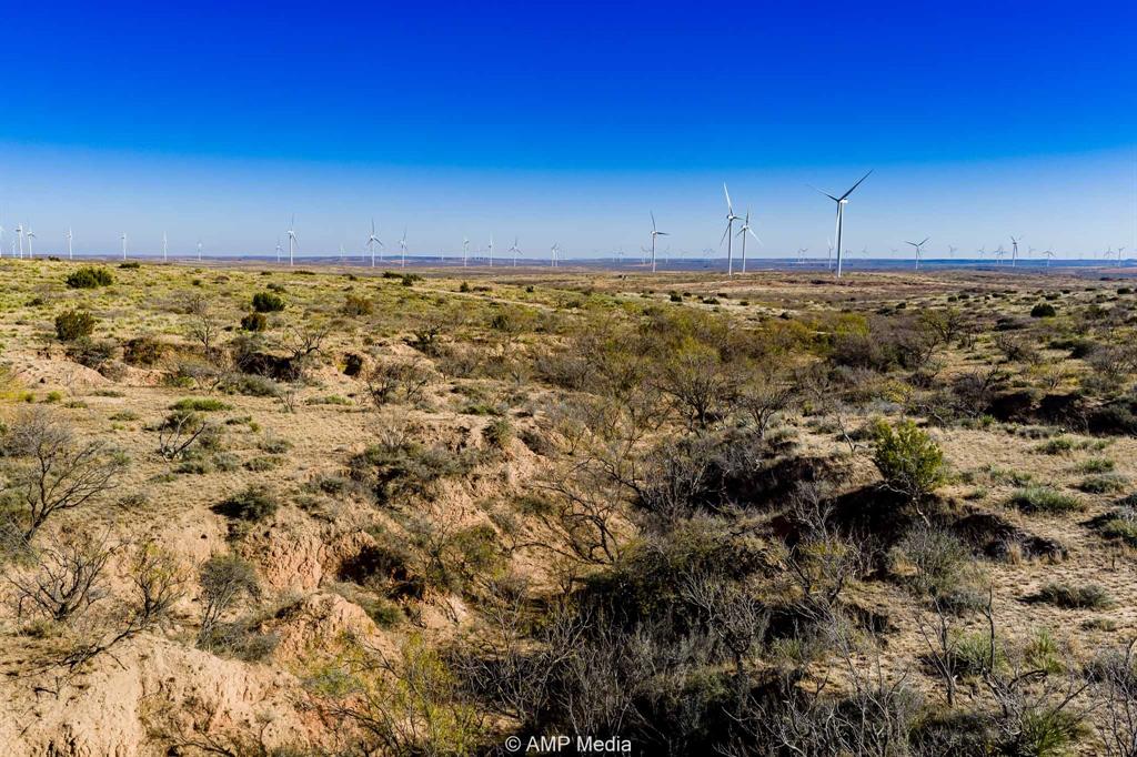 Cr Cr 450th Roscoe, TX 79545 - Photo 29 of 39 a view of a room with an empty space and wooden floor