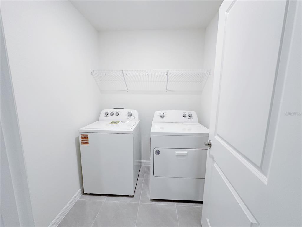 4683 Southwest 88th Lane Ocala, FL 34476 - Photo 15 of 16 a utility room with dryer and washer