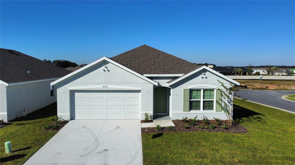 4683 Southwest 88th Lane Ocala, FL 34476 - Photo 2 of 16 a view of a house with a yard