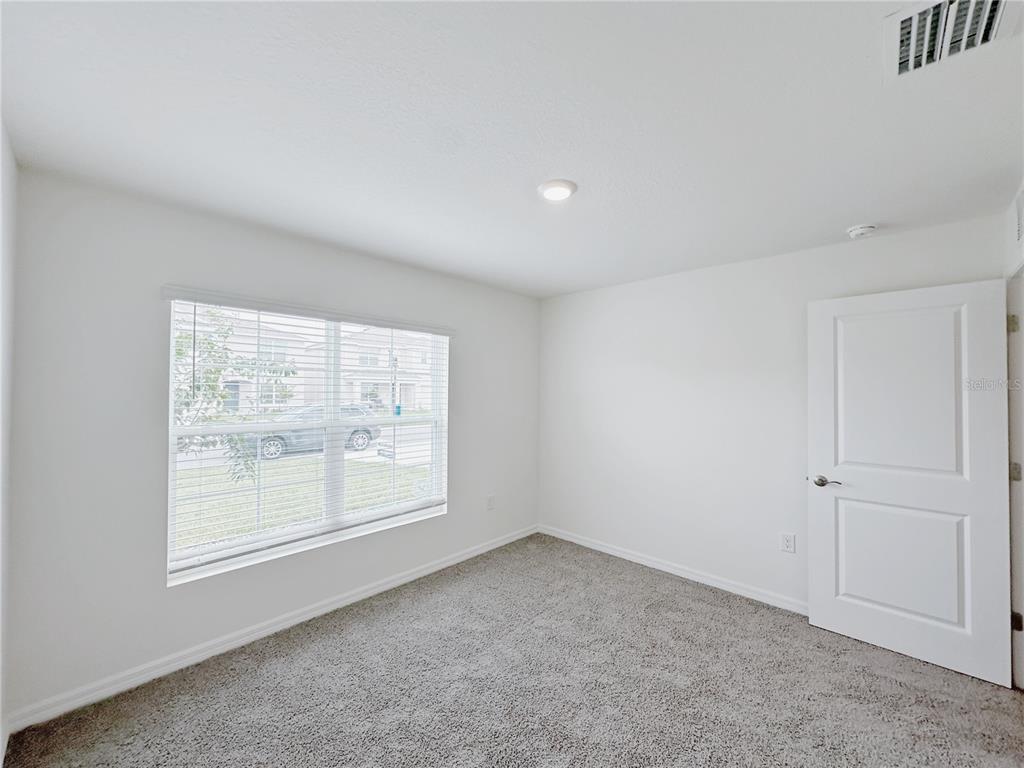 4683 Southwest 88th Lane Ocala, FL 34476 - Photo 8 of 16 an empty room with a window