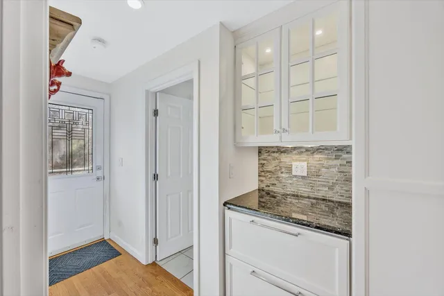 a room that has a rug and a window in it