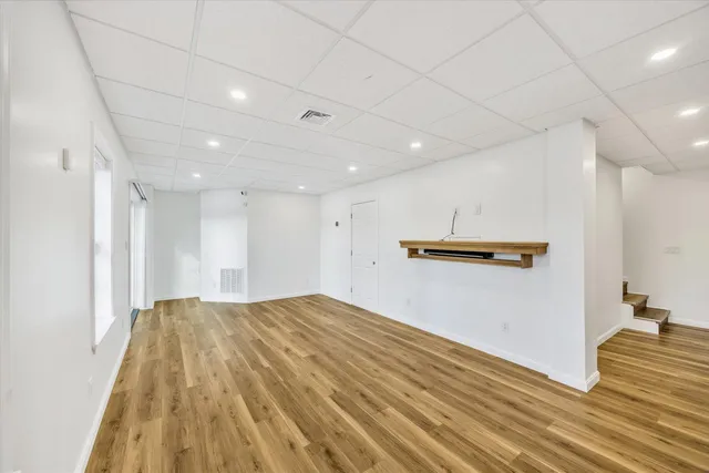 a view of a livingroom with wooden floor