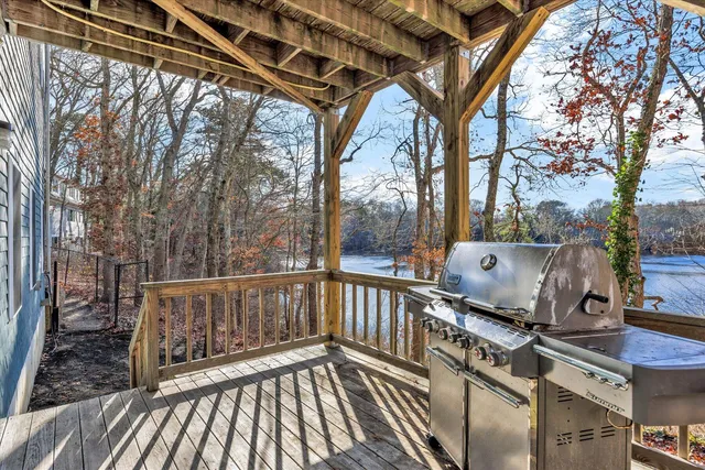 a view of deck with wooden floor and outdoor seating