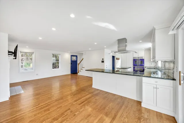 a kitchen with stainless steel appliances granite countertop a sink and cabinets
