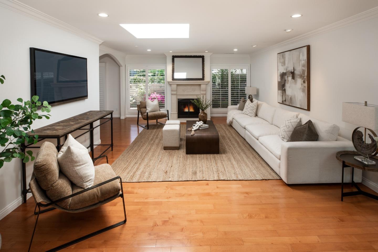 70 Bay Tree Lane Los Altos, CA 94022 - Photo 11 of 37 a living room with furniture a flat screen tv and a fireplace