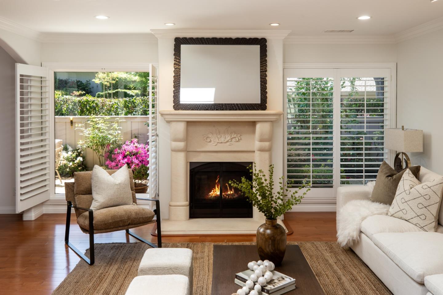 70 Bay Tree Lane Los Altos, CA 94022 - Photo 12 of 37 a living room with furniture a fireplace and a floor to ceiling window