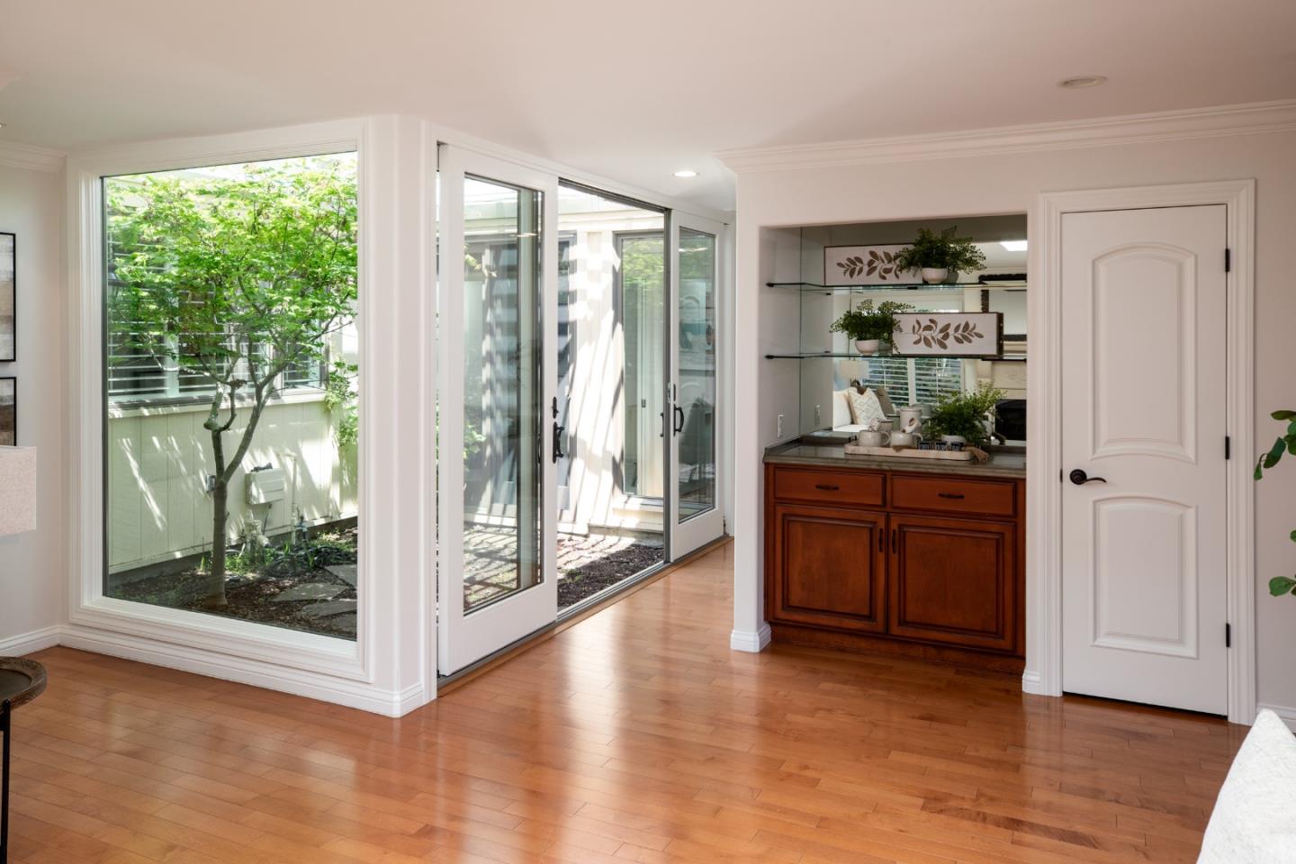 70 Bay Tree Lane Los Altos, CA 94022 - Photo 13 of 37 a room with a large window and kitchen view