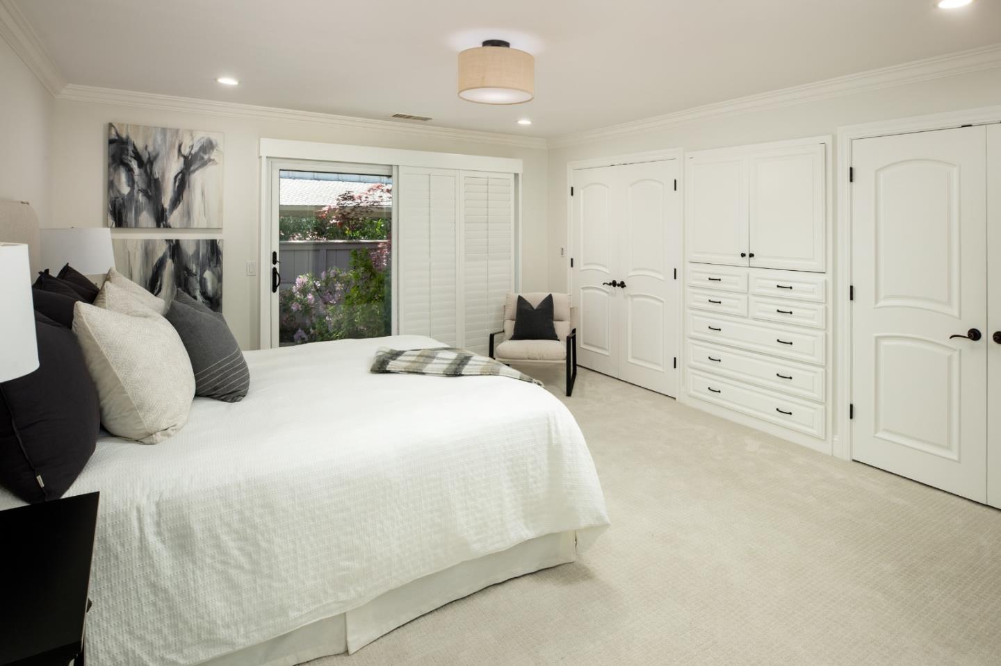 70 Bay Tree Lane Los Altos, CA 94022 - Photo 19 of 37 a spacious bedroom with a bed and a window