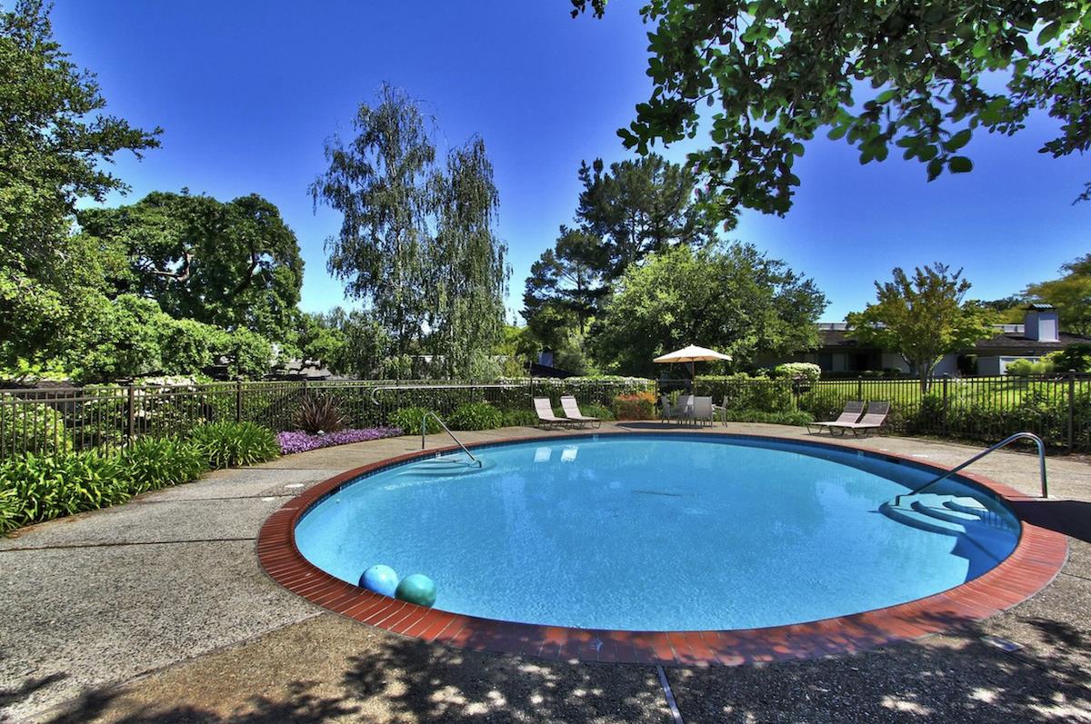 70 Bay Tree Lane Los Altos, CA 94022 - Photo 34 of 37 a view of a swimming pool with an outdoor space and seating area