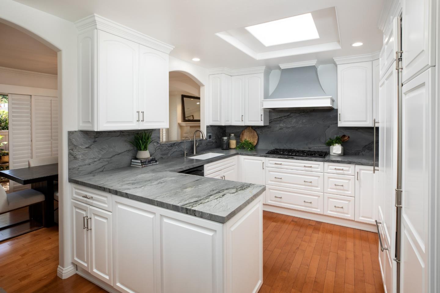 70 Bay Tree Lane Los Altos, CA 94022 - Photo 5 of 37 a kitchen with appliances a sink and cabinets