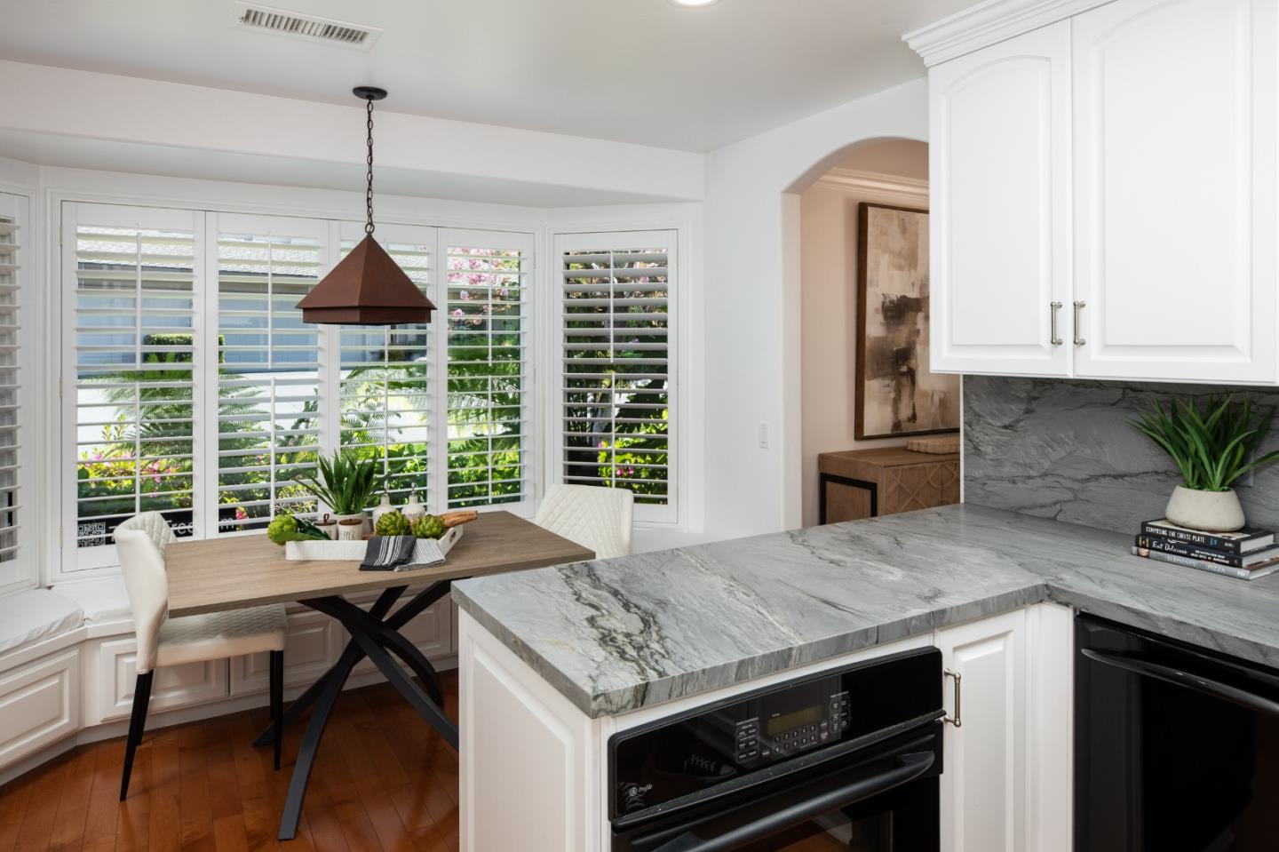 70 Bay Tree Lane Los Altos, CA 94022 - Photo 6 of 37 a kitchen with a stove a sink a counter space and dining table