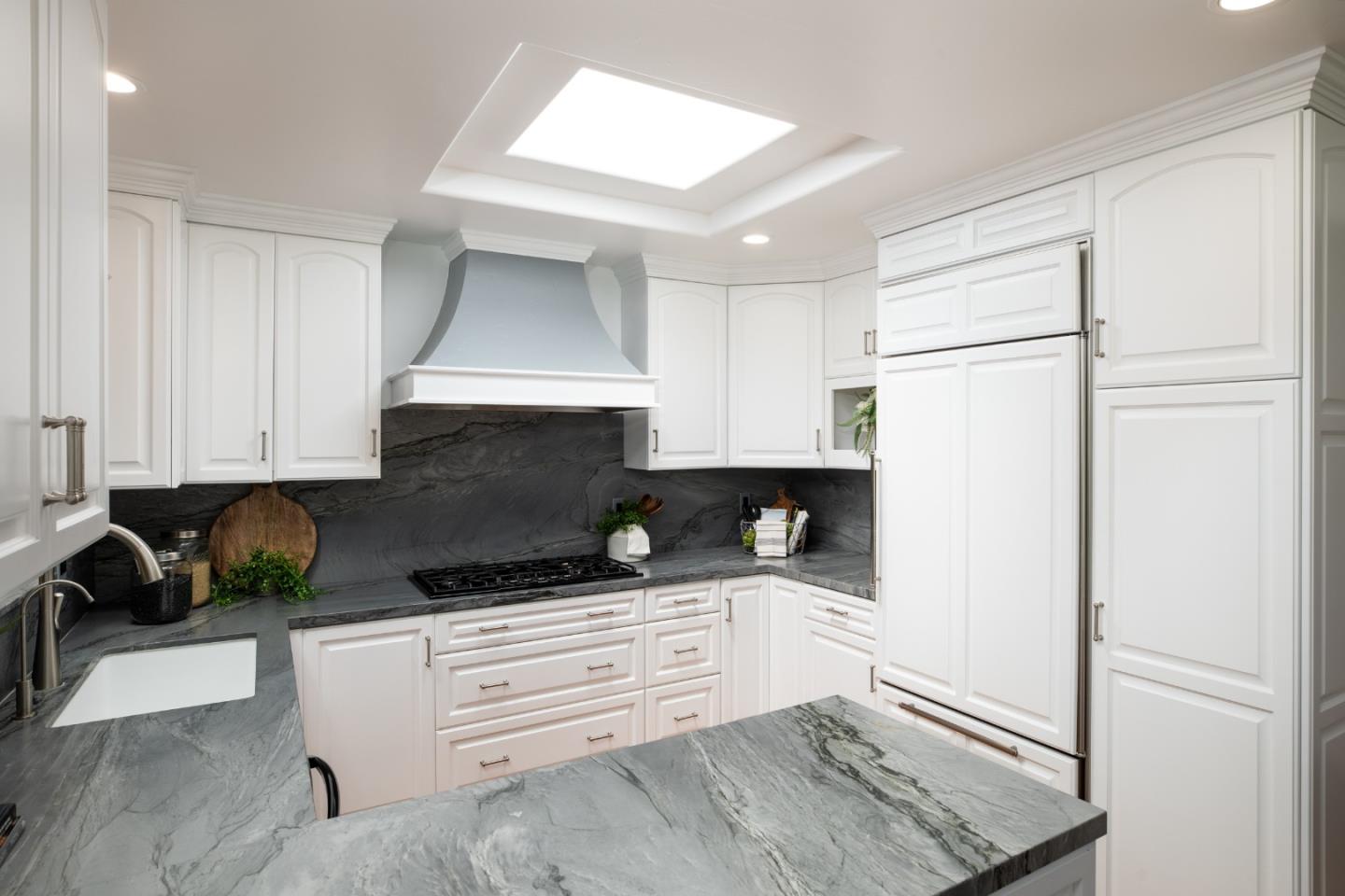 70 Bay Tree Lane Los Altos, CA 94022 - Photo 7 of 37 a kitchen with white cabinets and refrigerator