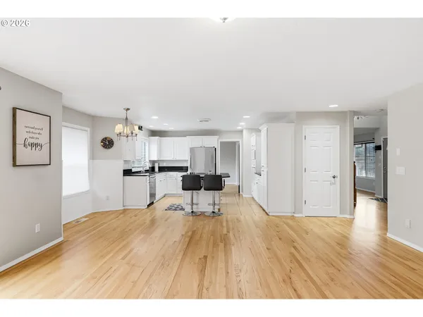 a view of a kitchen with wooden floor