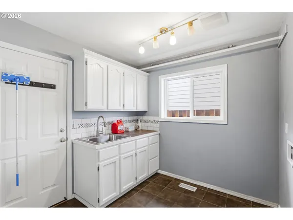 a kitchen that has a cabinets and a window