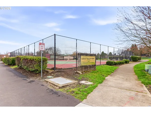 a view of a park with swings and slides
