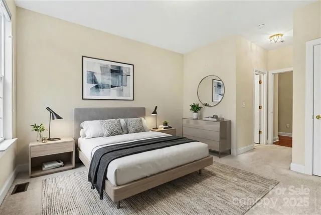 a bathroom with a sink a toilet a mirror and shower