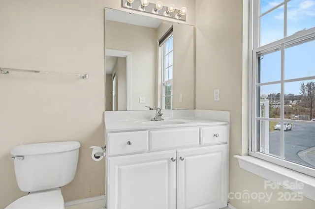 a bathroom with a toilet and a tub
