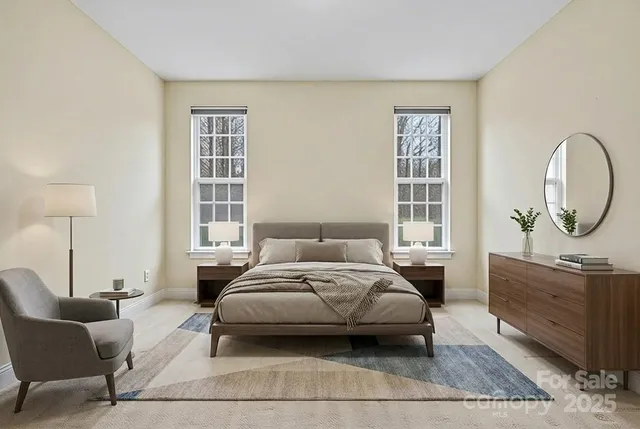 a bedroom with a bed a mirror and a window