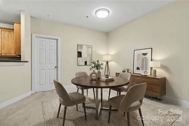 a kitchen with granite countertop a stove sink and microwave