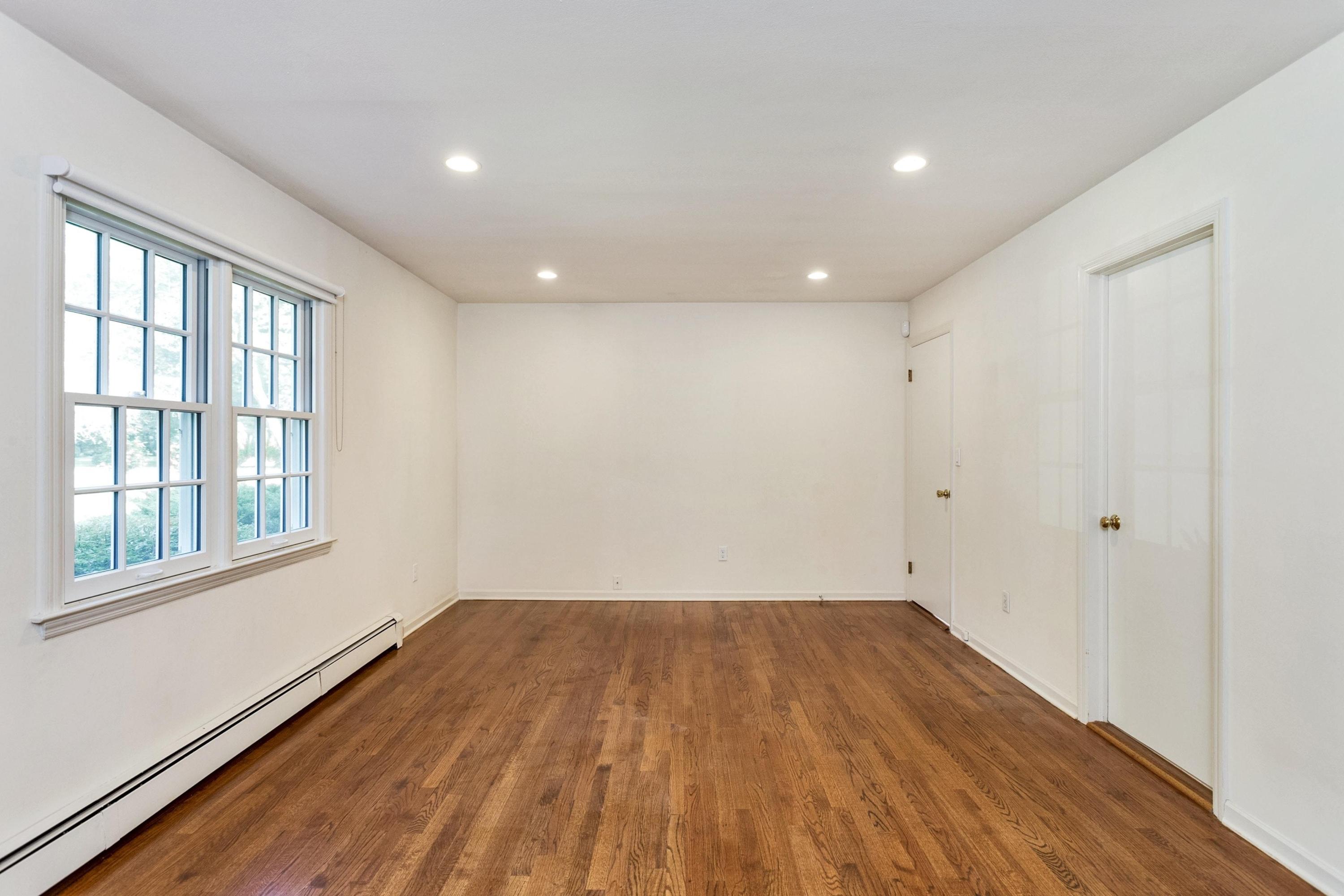 1 Wilson Ridge Road Darien, CT 06820 - Photo 12 of 22 a view of empty room with wooden floor and fan