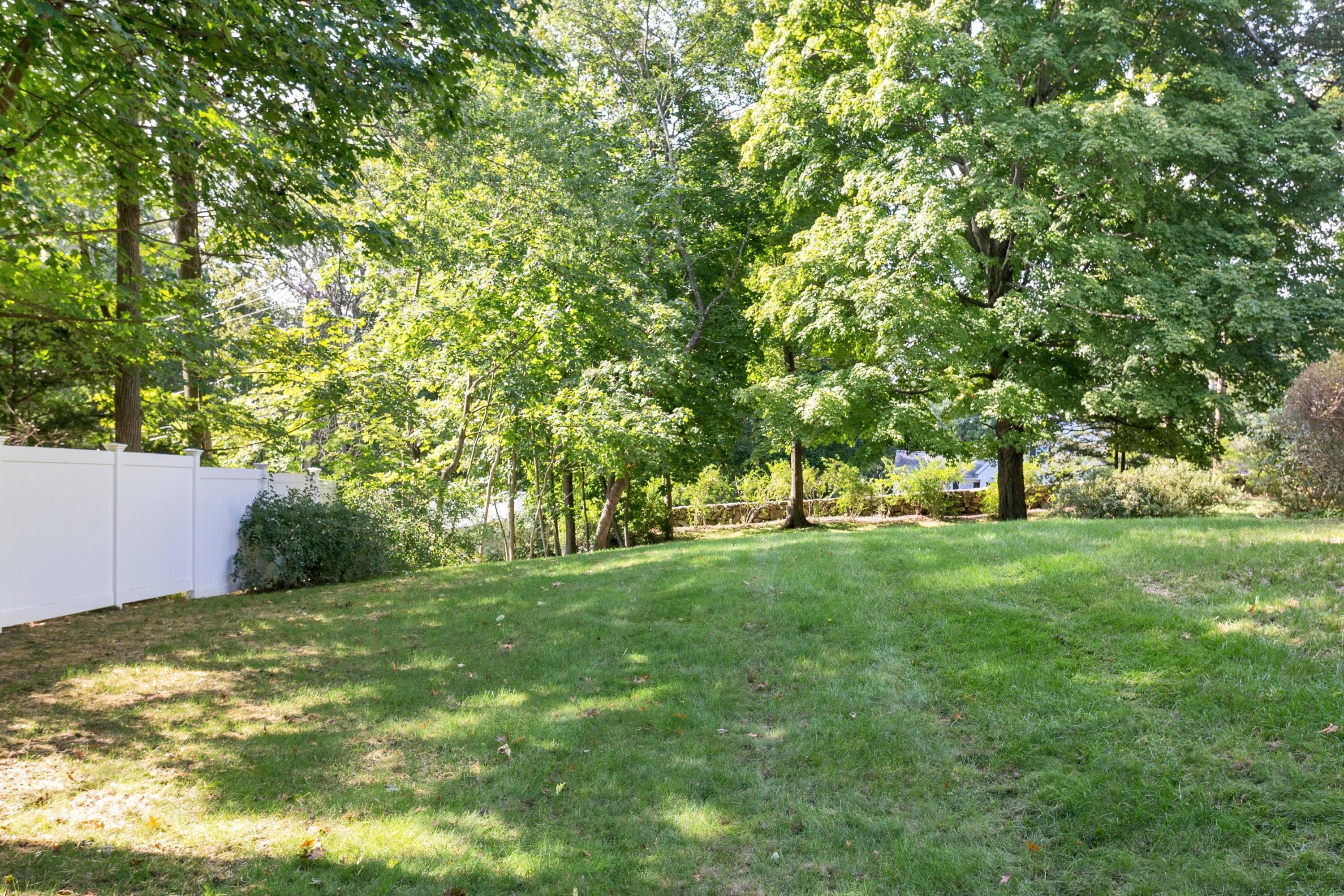 1 Wilson Ridge Road Darien, CT 06820 - Photo 18 of 22 a backyard of a house with lots of green space