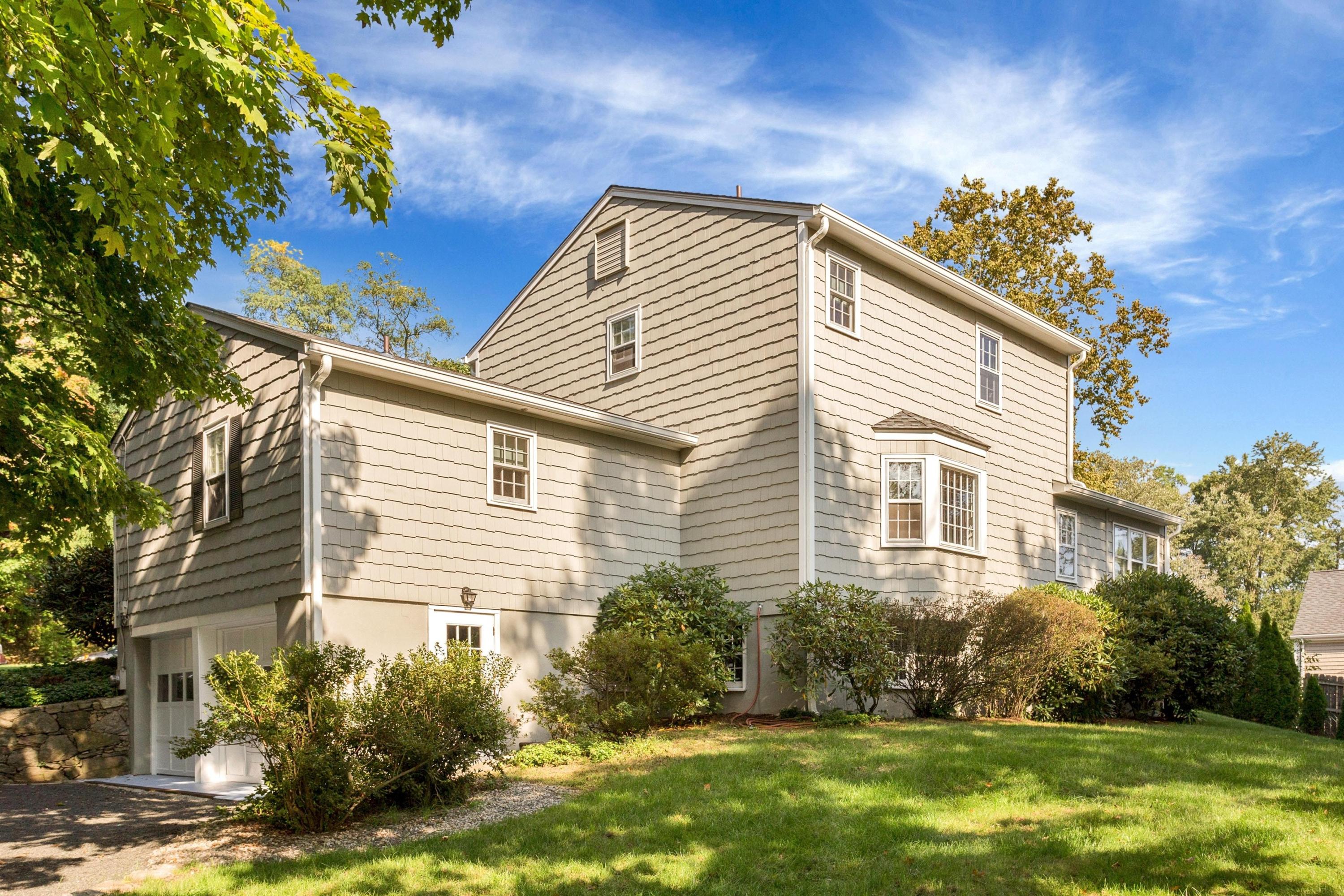 1 Wilson Ridge Road Darien, CT 06820 - Photo 19 of 22 a view of a house with a yard